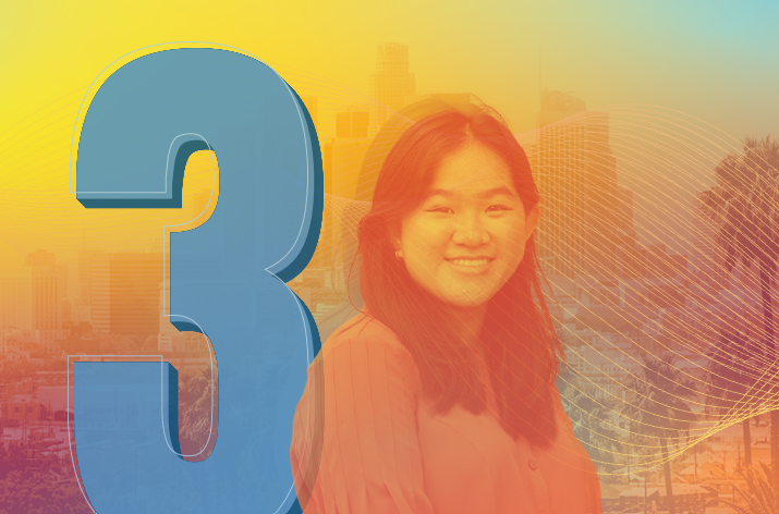 3 Student smiles with LA in the background.