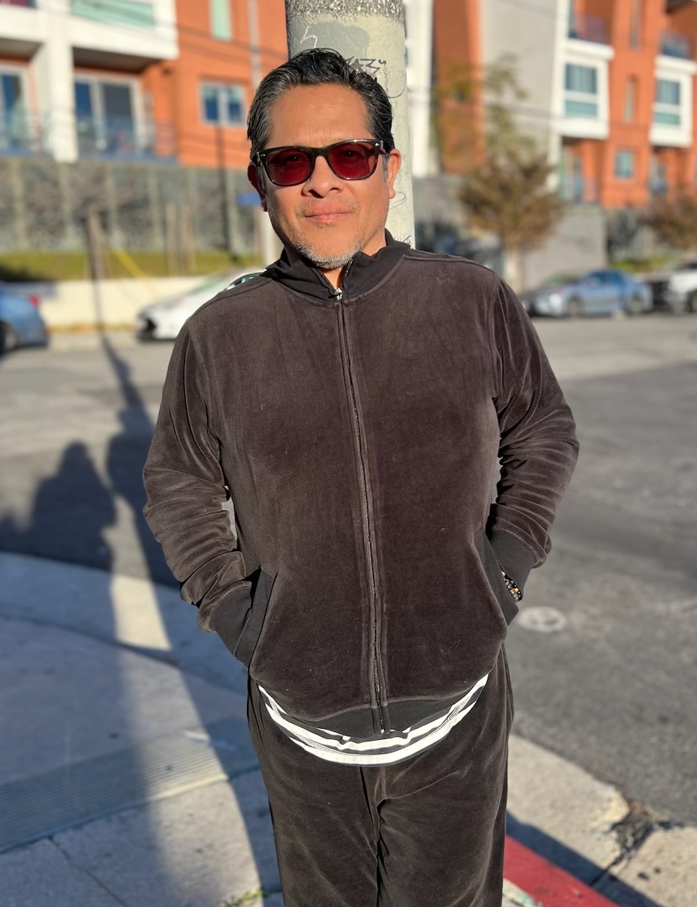 Gregory wearing sunglasses standing outside