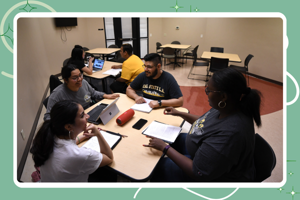 Group of students smiling, studying together