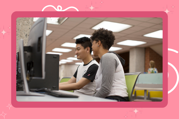 Two Students Sitting by the Computers