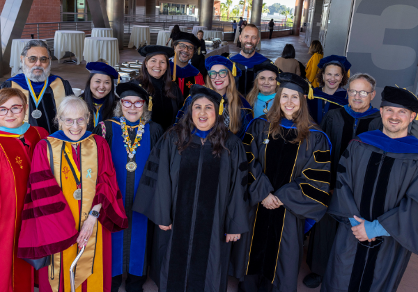 Group of people wearing doctoral regalia