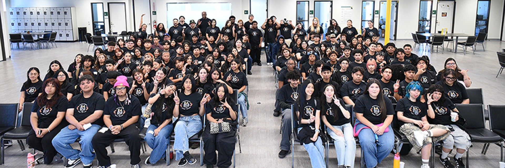 A large group of students seated and facing forward.