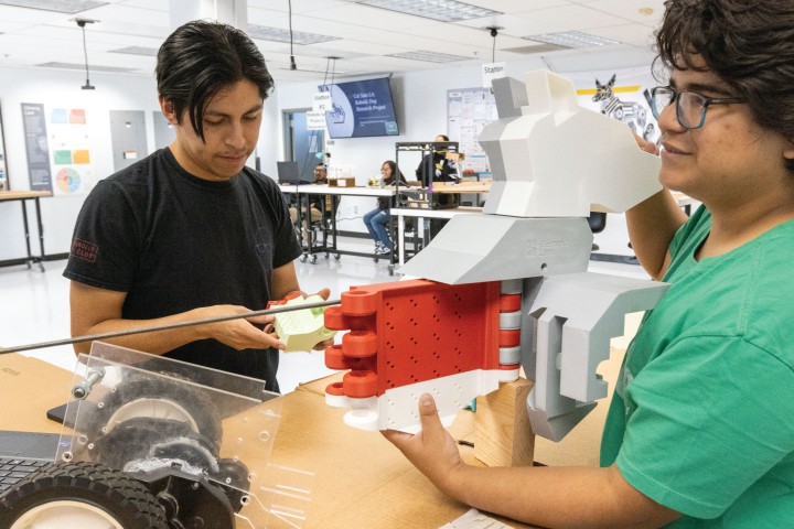 students in CoLab working on robotic project