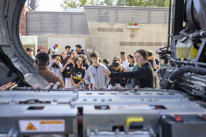 H2 truck electronics encircles student crowd