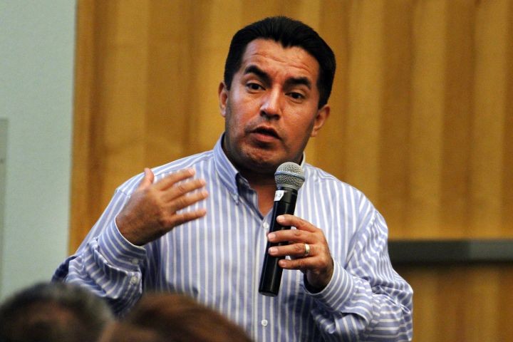 Man speaking into microphone