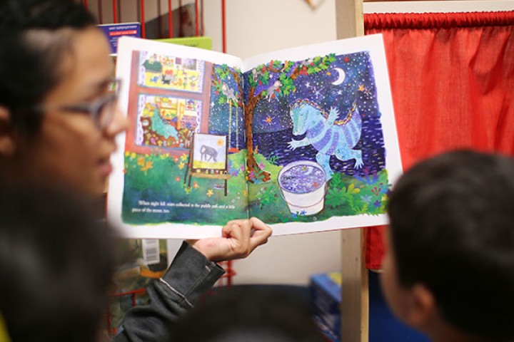 Instructor reading to child