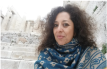 Claudia in front of gray steps