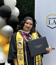 Diana in black MA graduation regalia