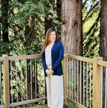 Joanna standing in front of redwood tree