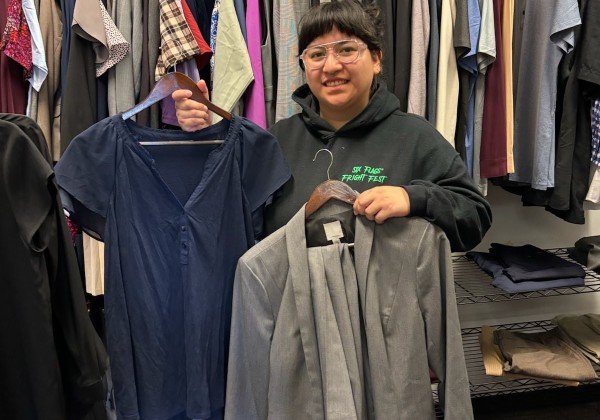 Student shops for clothing in the Career Clothing Closet.