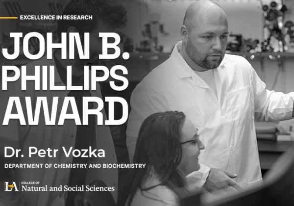 Graphic announcing that Dr. Petr Vozka of Cal State LA’s Department of Chemistry and Biochemistry received the John B. Phillips Award, shown working with students in a laboratory.