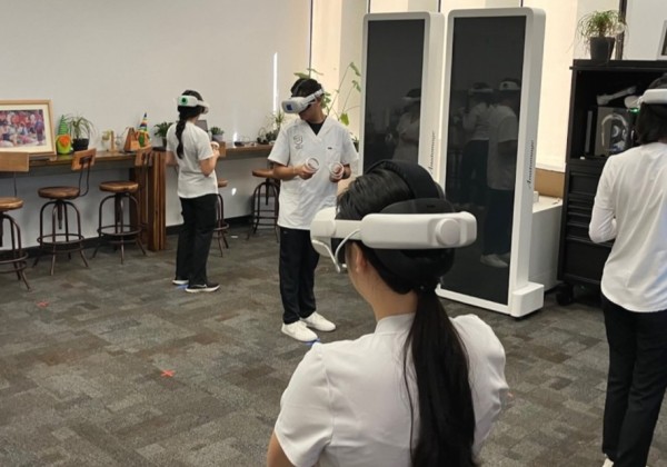Students use virtual reality headsets and controllers during a hands-on simulation activity inside the O’Hara Center at Cal State LA. 