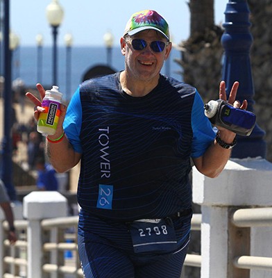 Christopher Harris running at the Oceanside Half Ironman, 2025