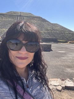 Profe Lopez in front in front of Mexica pyramid