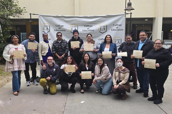Group of dean's list students and faculty posing for picture