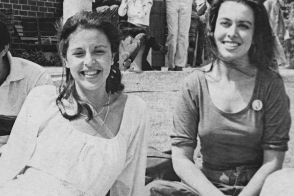 A group of students on a campus lawn